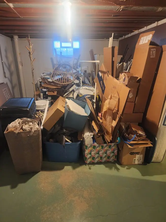 Roll-off dumpster container at job site for Construction Dumpster Rental in Wharton